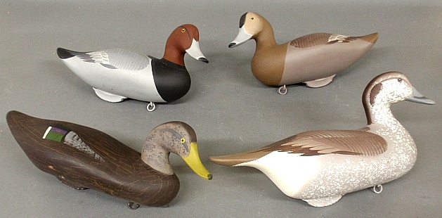 Appraisal: - Pair of black duck decoys h x l and