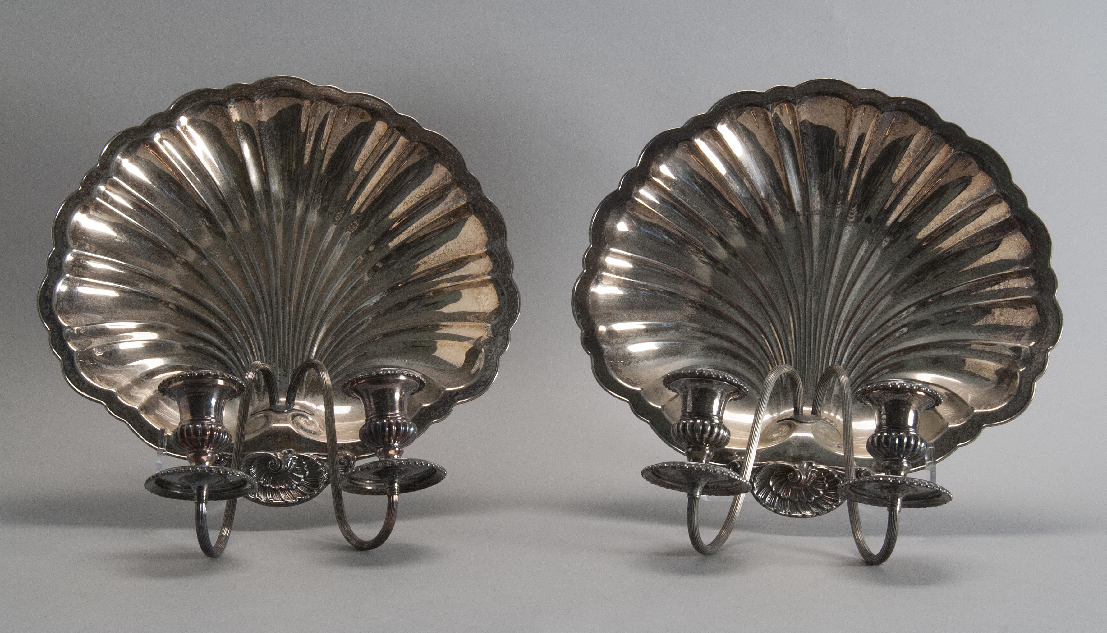 Appraisal: PAIR OF PRILL SILVER CO SHELL-FORM SILVER PLATED TWO-LIGHT WALL