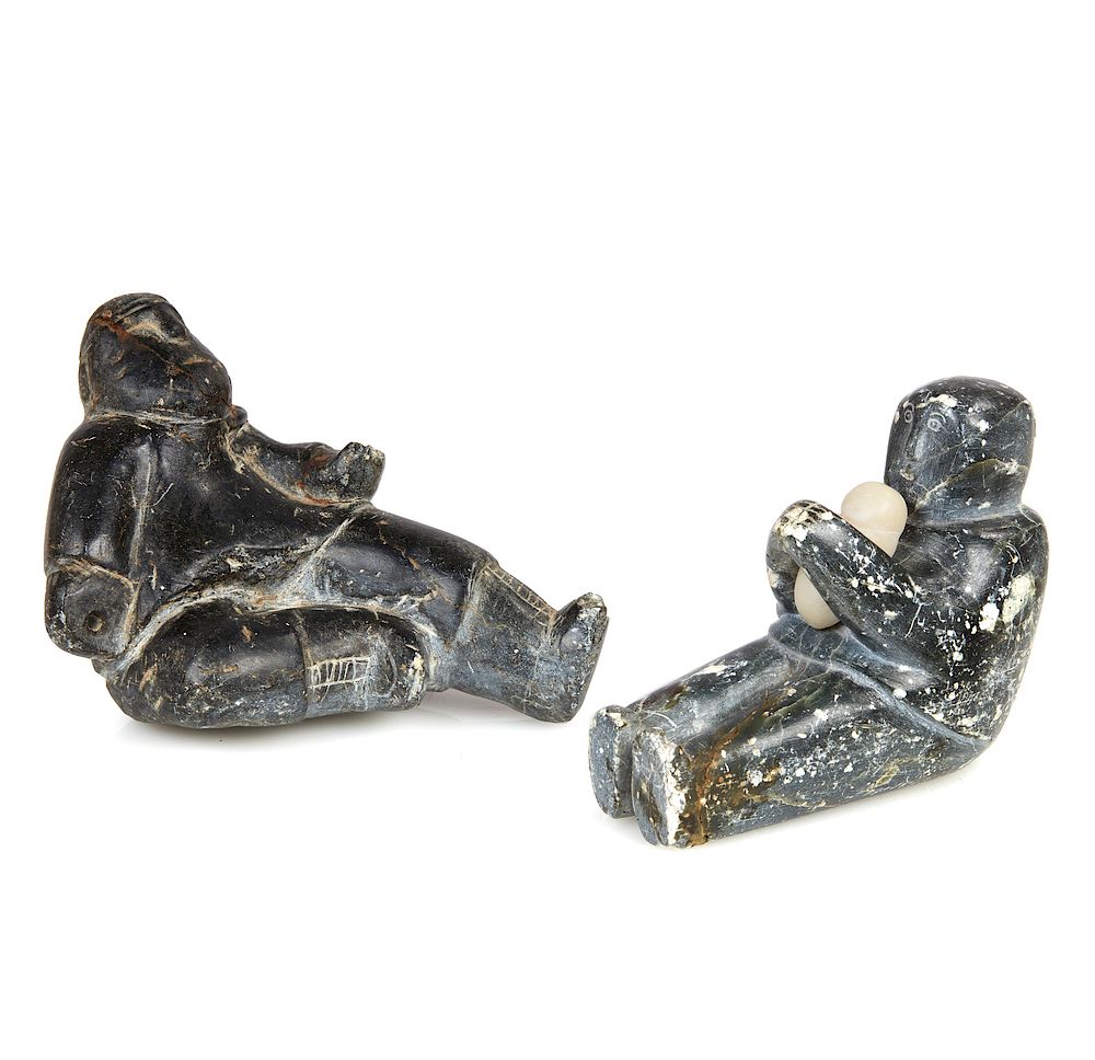 Appraisal: Two Inuit Figural Carvings Two Inuit seated figural carvings comprising