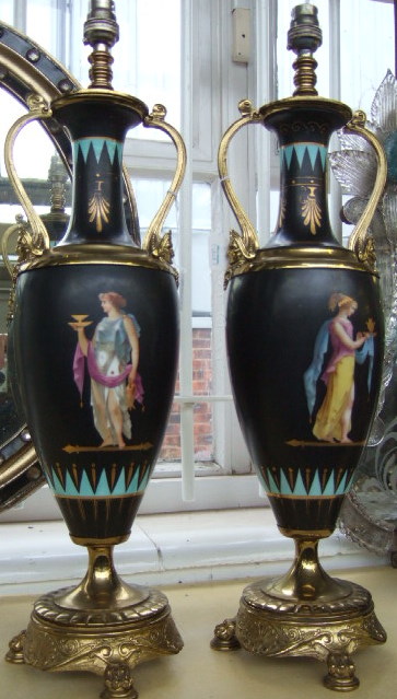 Appraisal: A pair of earthenware and gilt bronze lamps late th