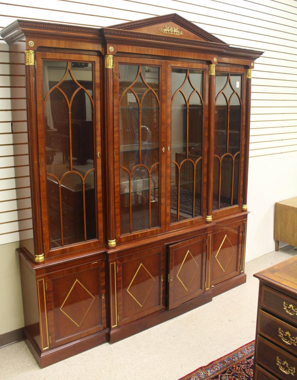 Appraisal: NEOCLASSICAL STYLE MAHOGANY BREAKFRONT CHINA CABINET Kindel Furniture Co Historic