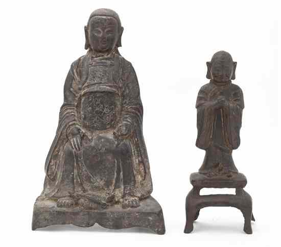 Appraisal: A Chinese Metal Figure of a Buddhist Disciple together with