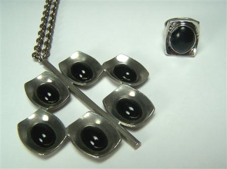 Appraisal: JORGEN JENSEN - a pewter pendant with chain composed of