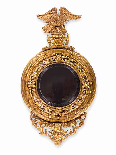 Appraisal: A Regency giltwood and parcel ebonized convex mirror first quarter