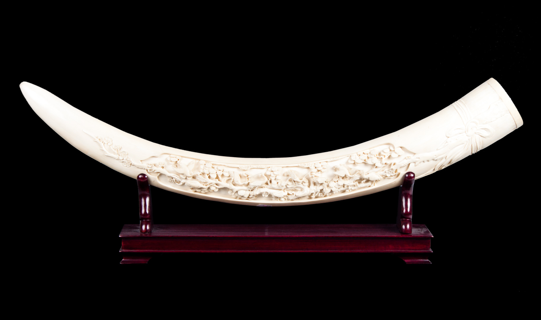 Appraisal: Chinese elaborately carved ivory tusk natural tusk with relief decoration