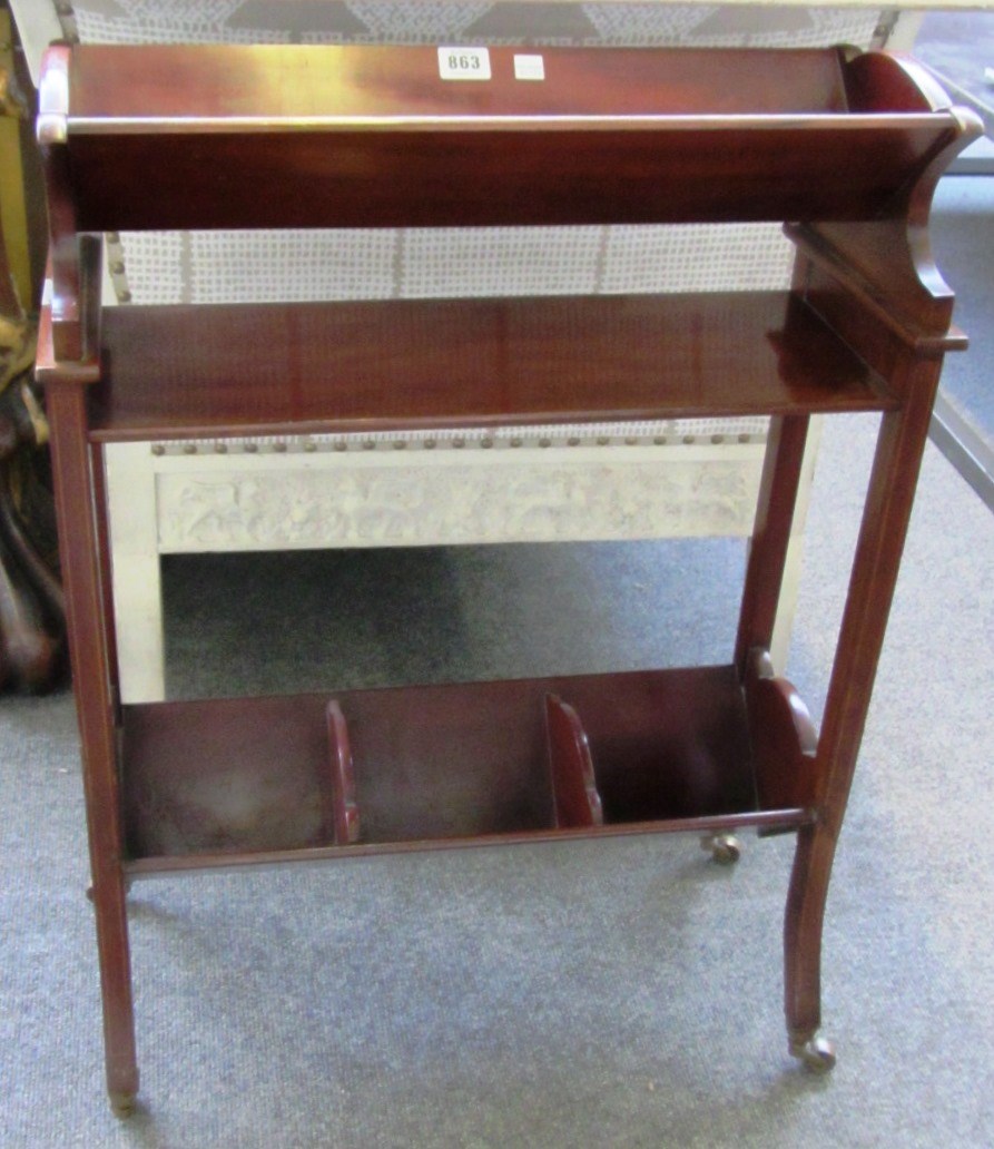 Appraisal: An Edwardian marquetry inlaid mahogany two tier book trough on