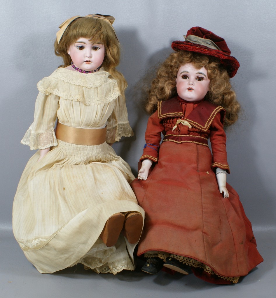 Appraisal: German Bisque Shoulder Head Dolls the larger in white dress