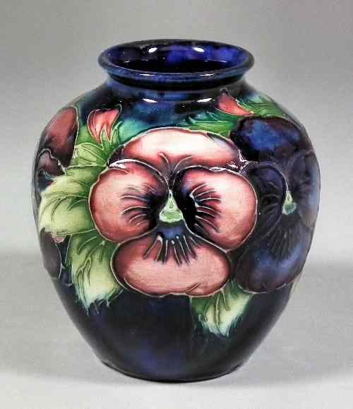 Appraisal: A Moorcroft pottery baluster shaped vase tube lined and decorated