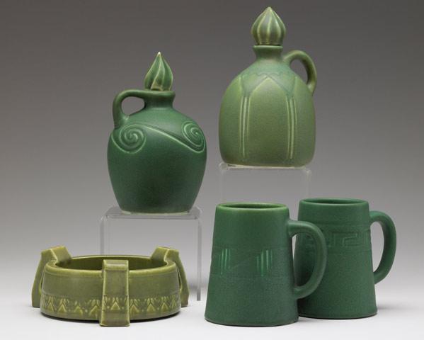 Appraisal: ROOKWOOD Five matte green Production pieces two stoppered jugs two