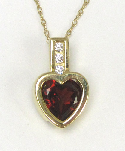 Appraisal: GARNET HEART DIAMOND AND FOURTEEN KARAT GOLD PENDANT NECKLACE The