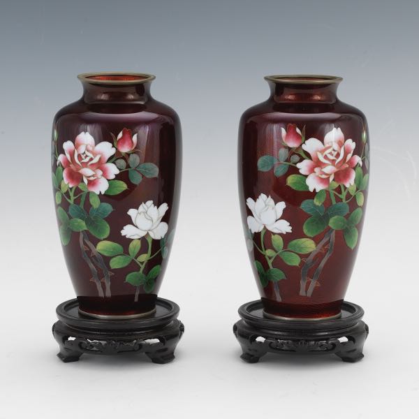 Appraisal: PAIR OF JAPANESE GINBARI CLOISONNE MIRROR IMAGE VASES ON WOOD