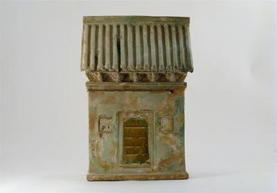 Appraisal: A Chinese pottery model of a house with a ridged