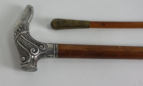 Appraisal: A Victorian silver handled walking cane London the embossed handle