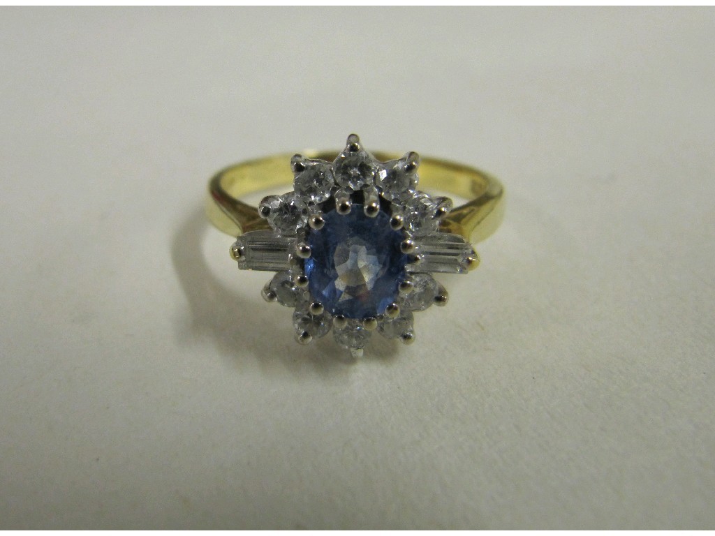 Appraisal: Eighteen carat bi colour gold Ceylon sapphire and diamond cluster