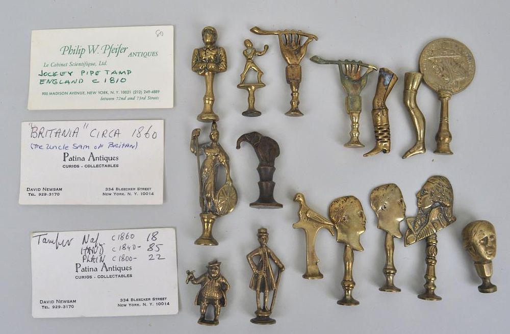 Appraisal: Group Figural Brass Pipe Tampers including two hand form two