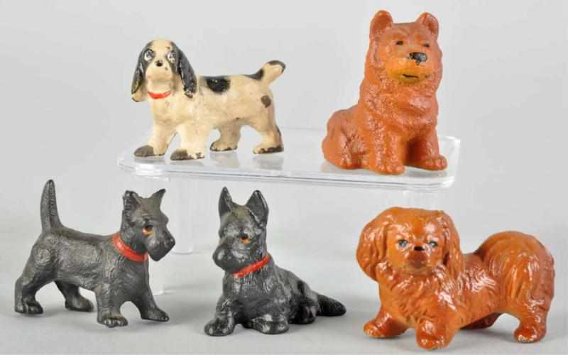 Appraisal: Lot of Cast Iron Dog Paperweights Description Made by Hubley