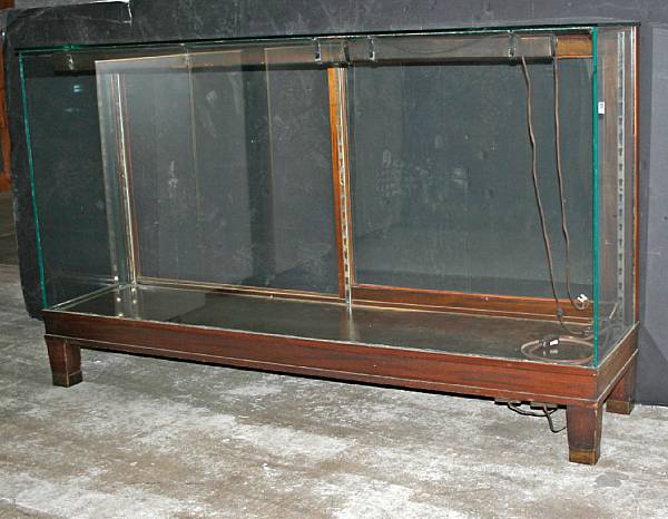 Appraisal: A glass and wood horizontal display cabinet Opening to the