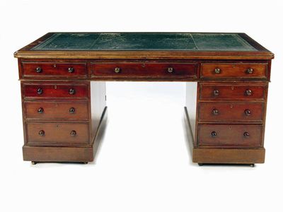 Appraisal: A Victorian mahogany partners pedestal desk the leather inset top