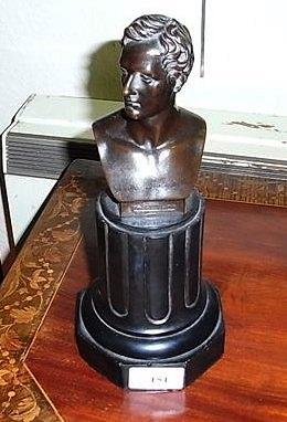 Appraisal: A BRONZE BUST OF LORD BYRON on a black marble