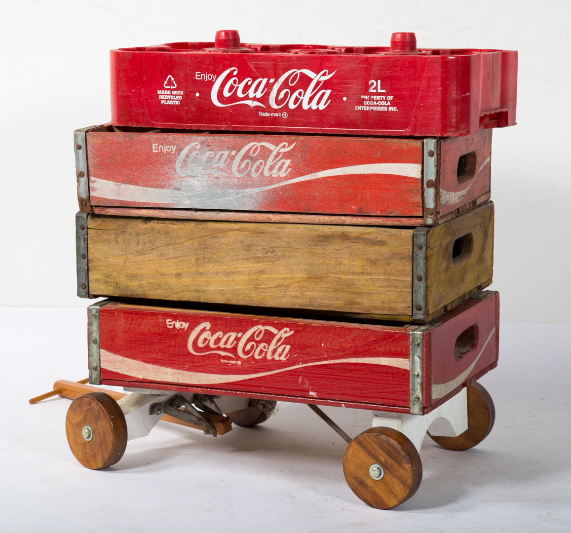 Appraisal: Three Coca-Cola bottle carriers and wagon Undernumber