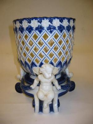 Appraisal: A MINTONS PORCELAIN JARDINIERE of ovoid form pierced with trellis