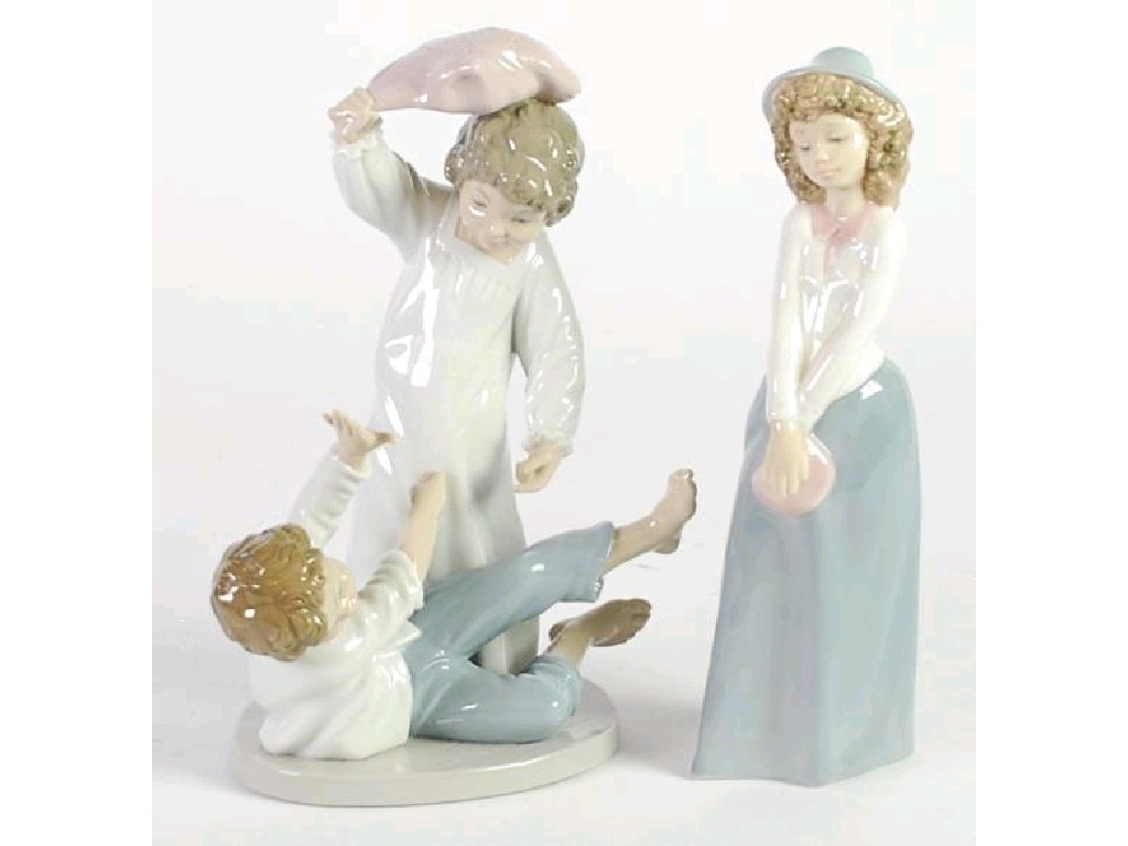 Appraisal: TWO NAO SPANISH PORCELAIN FIGURE OF CHILDREN one modelled as