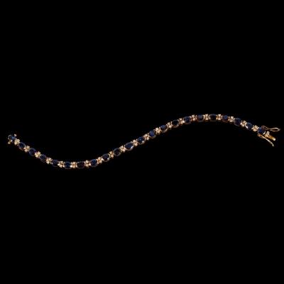 Appraisal: A sapphire and diamond bracelet the twenty-two oval sapphires interspersed