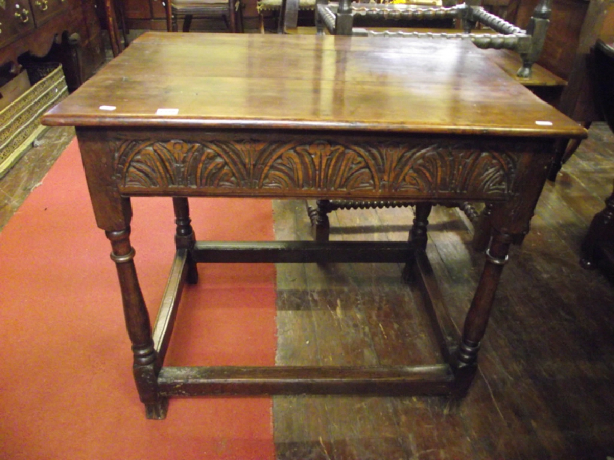 Appraisal: An old English oak side table with plank top with