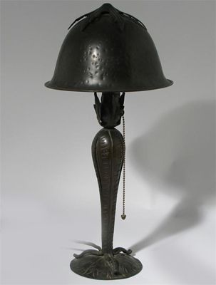 Appraisal: A patinated metal table lamp probably American domed shade with