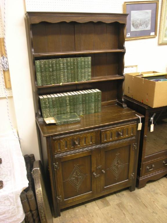 Appraisal: A reproduction dark oak Welsh dresser with two shelf plate