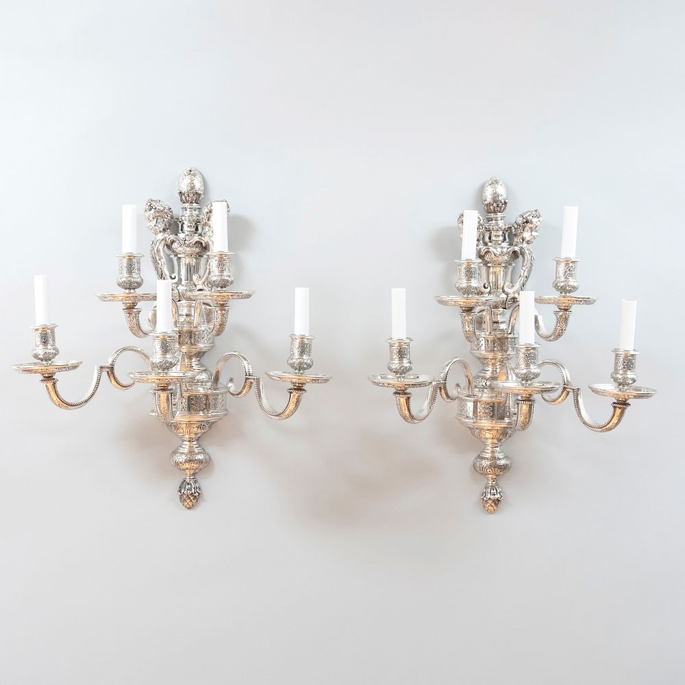 Appraisal: Pair of Silver Plated Five-Light Wall Sconces with Cherub Form