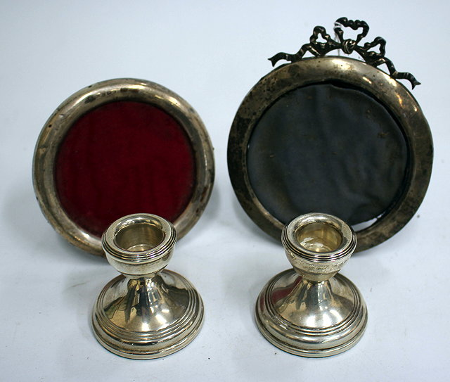 Appraisal: A PAIR OF SMALL SILVER CANDLESTICKS each cm in height