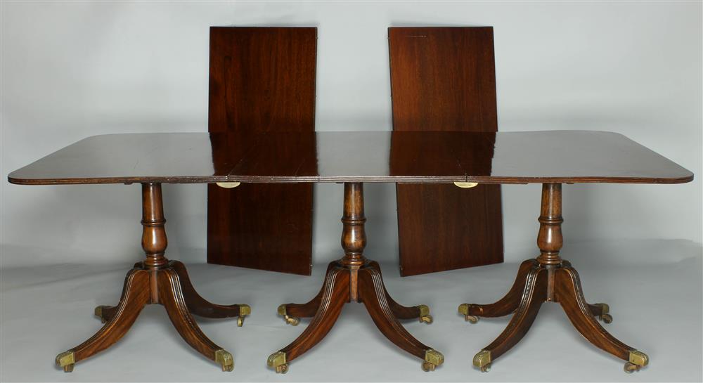 Appraisal: ENGLISH REGENCY MAHOGANY THREE-PEDESTAL DINING TABLE with two leaves having