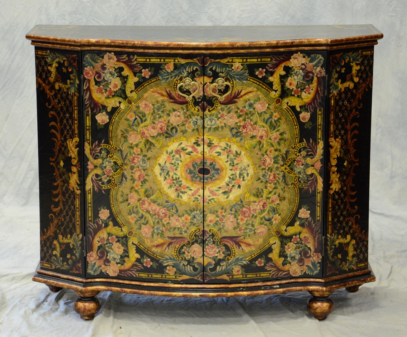 Appraisal: Ebonized and gilt floral decorated door Italian style commode h