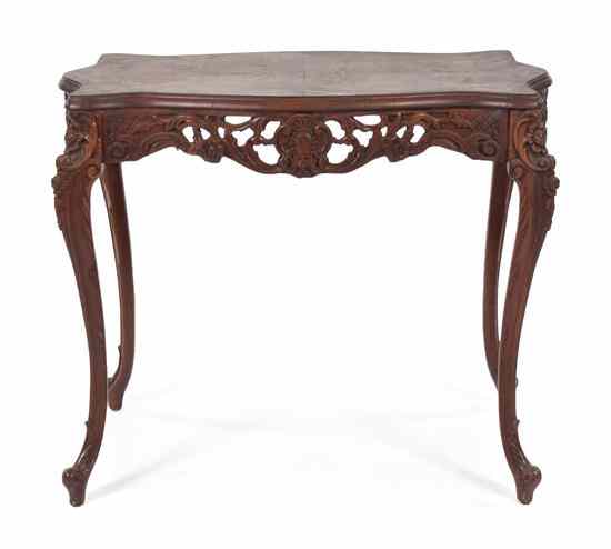 Appraisal: A Louis XV Style Occasional Table having a shaped cartouche