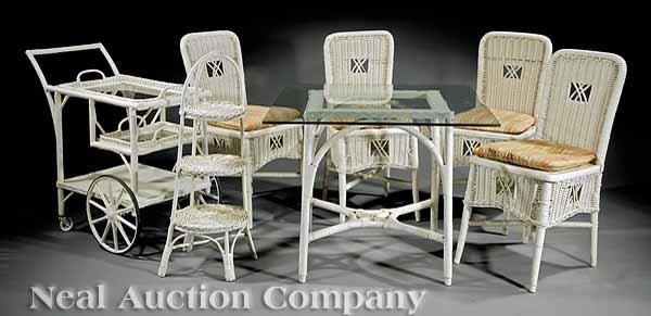 Appraisal: A Vintage Wicker Dining Suite comprising four side chairs a