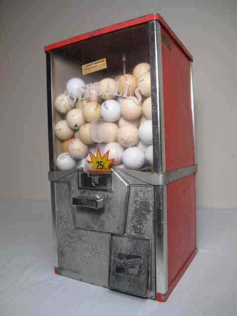 Appraisal: Vintage ''Northwestern'' cent golf ball dispenser Red painted metal with