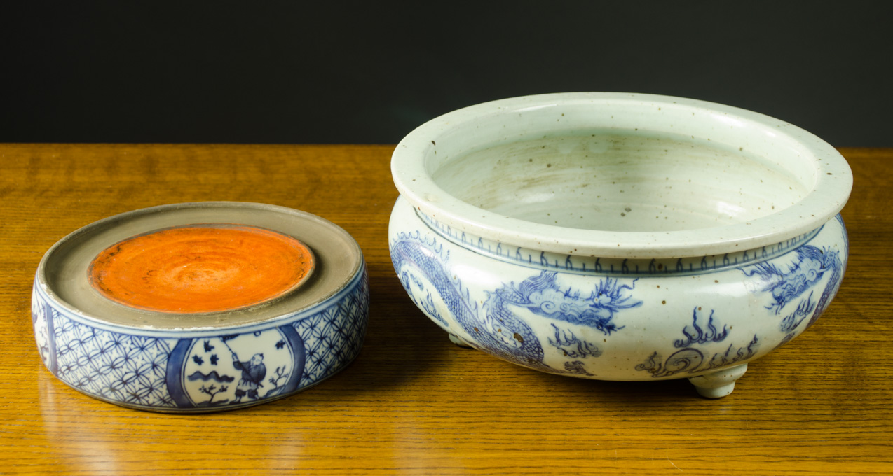 Appraisal: TWO CHINESE BLUE AND WHITE POTTERY VESSELS including a three-footed