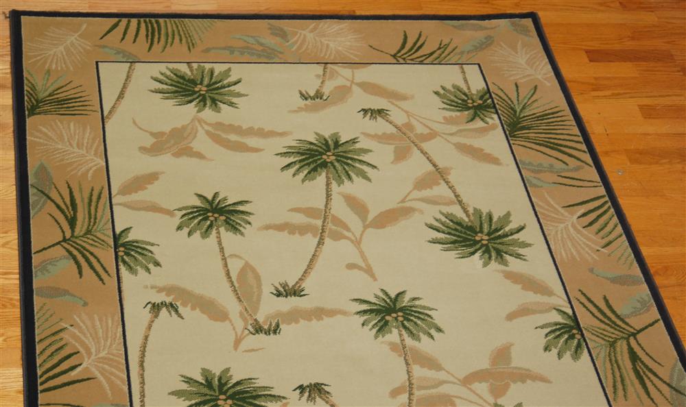 Appraisal: TRADEWINDS DESIGN POLYPROPYLENE RUG having a tropical design of palm