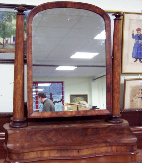 Appraisal: A mid Victorian mahogany arch top swing frame toilet mirror