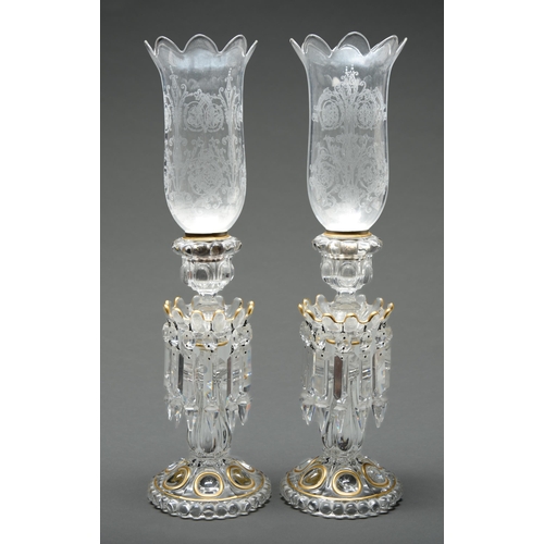 Appraisal: A pair of Baccarat moulded and gilt glass lustre candlesticks