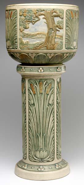 Appraisal: WELLER Zona jardiniere and pedestal set with panels of cattails