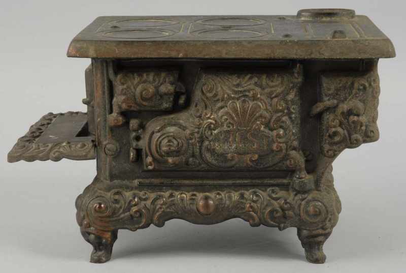 Appraisal: Cast Iron West Children's Stove Description Doesn't open Marked on