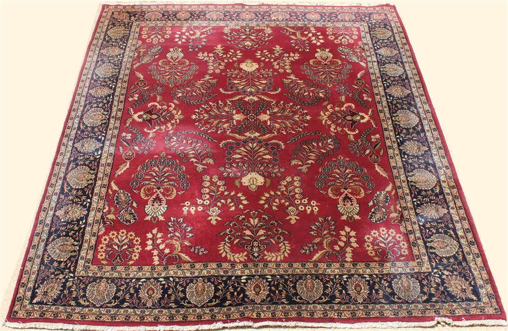 Appraisal: LARGE SAROUK WOOL RUG having floral sprays on a red