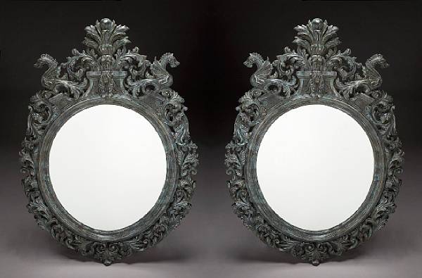 Appraisal: A pair of Renaissance style painted bronze mirrors Each oval