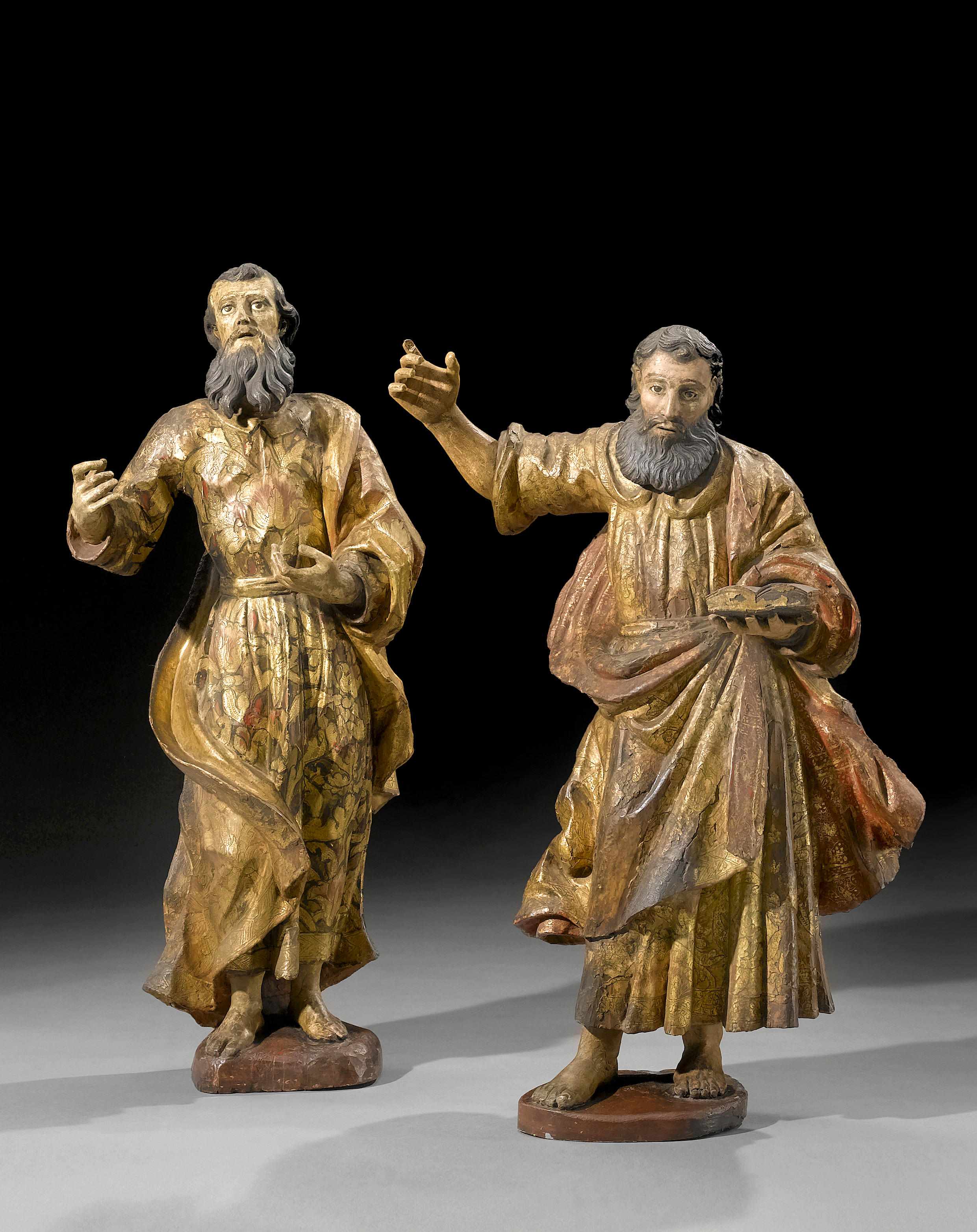 Appraisal: A pair of Spanish carved wood and al estofado decorated