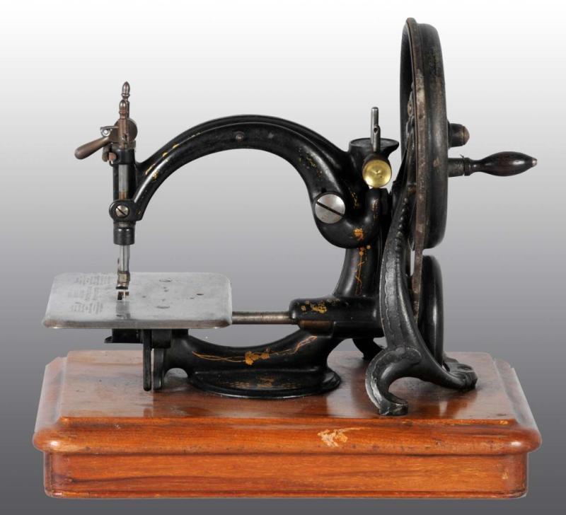 Appraisal: Cast Iron Wilcox Sewing Machine Description Unusual mechanism Working Condition