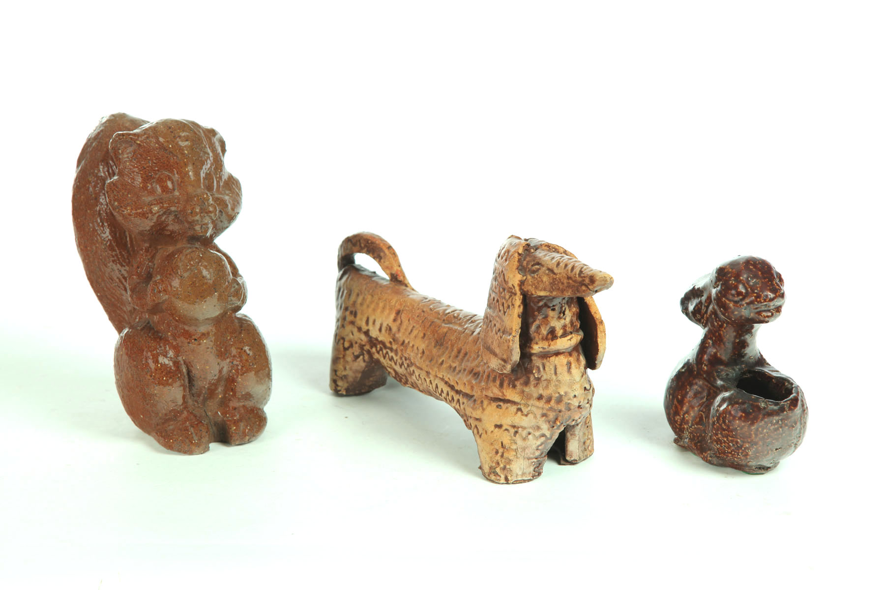 Appraisal: THREE SEWERTILE ANIMALS American th century Squirrel initialed ''JF'' ''h