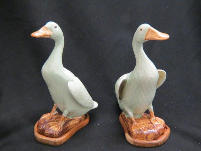 Appraisal: Pair of Chinese Porcelain Figurines of Ducks tall wooden stands