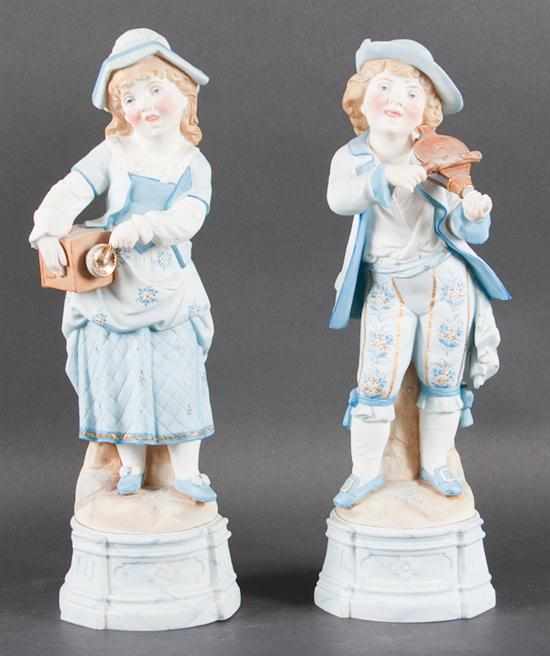 Appraisal: Pair Of Austrian painted bisque figures of a boy and